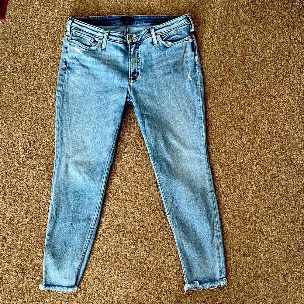 Womens SILVER jeans with frayed bottom. Light wash, Size 18 Length 29.